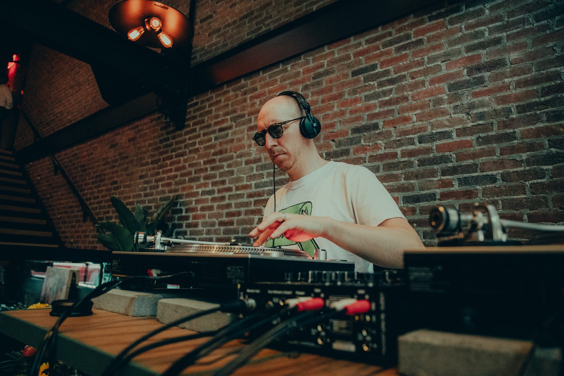 DJ set against brick