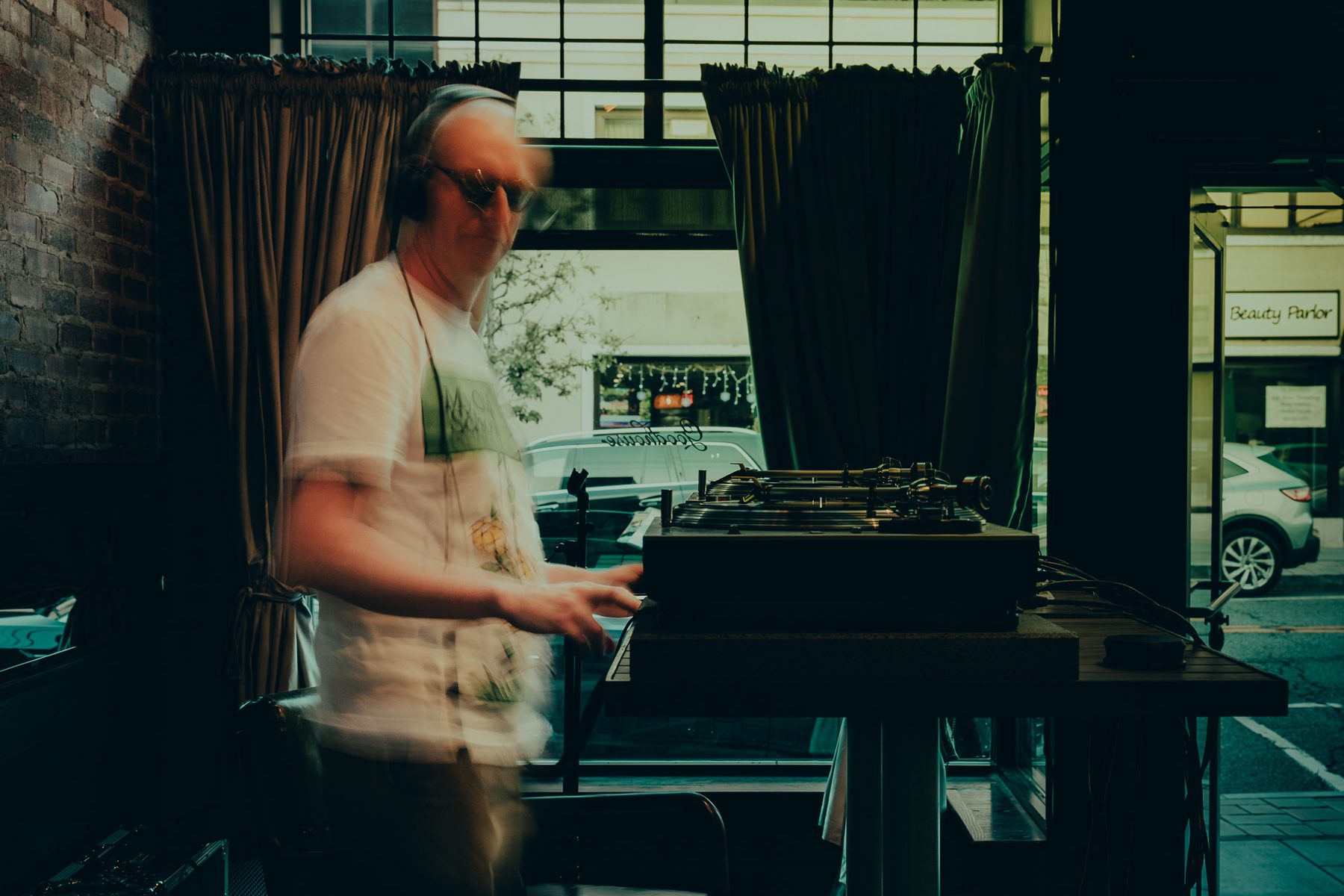 DJ in motion by the window