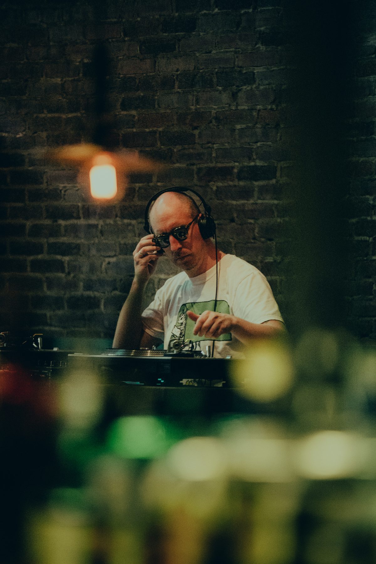 DJ under a hanging lamp