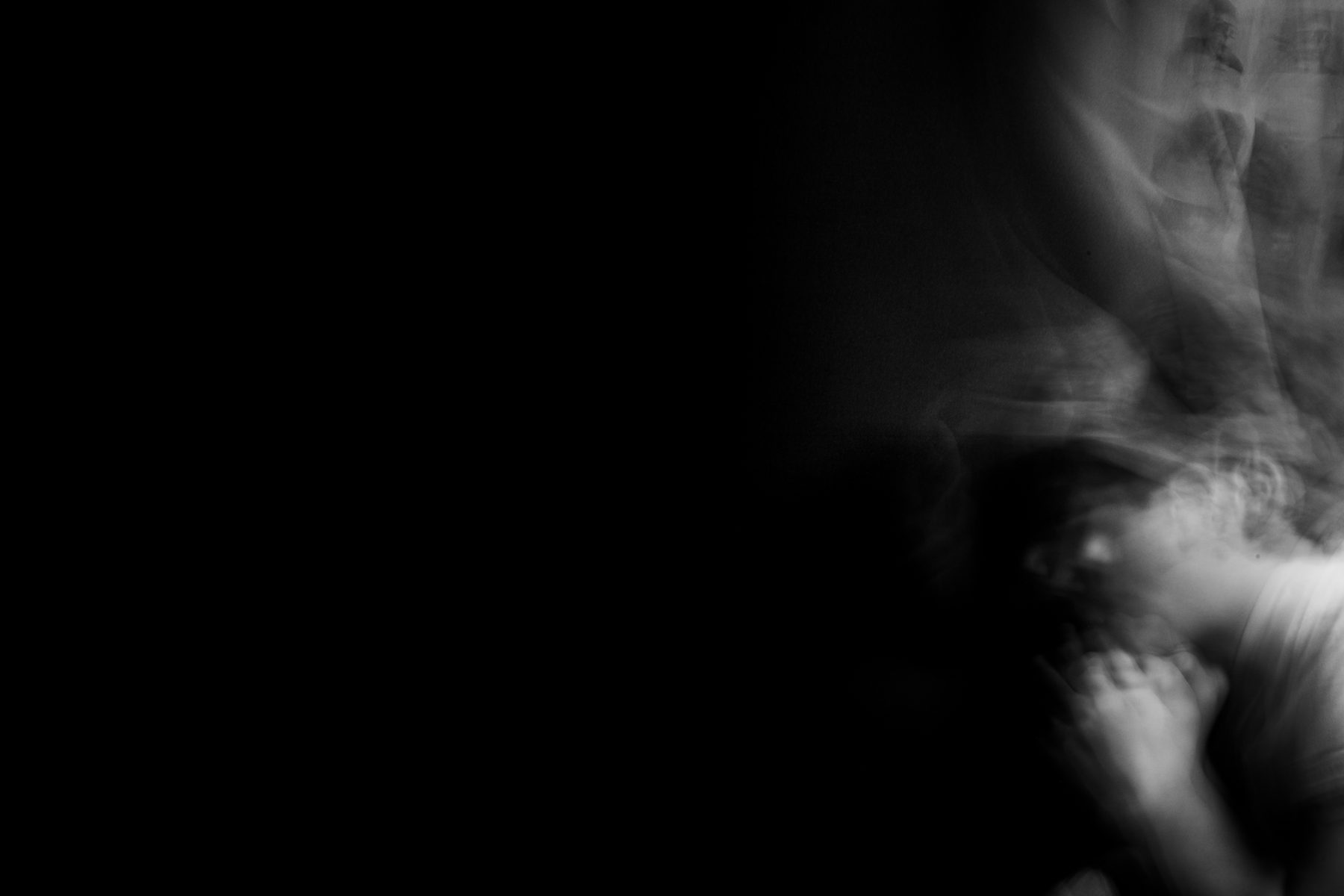 Figure dissolving into darkness in long exposure